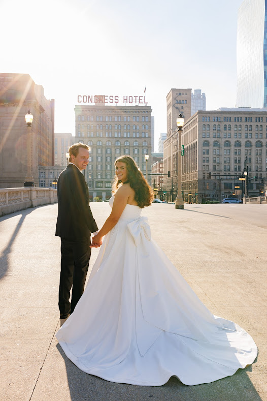 Bride and groom in front of Congress Plaza Hotel