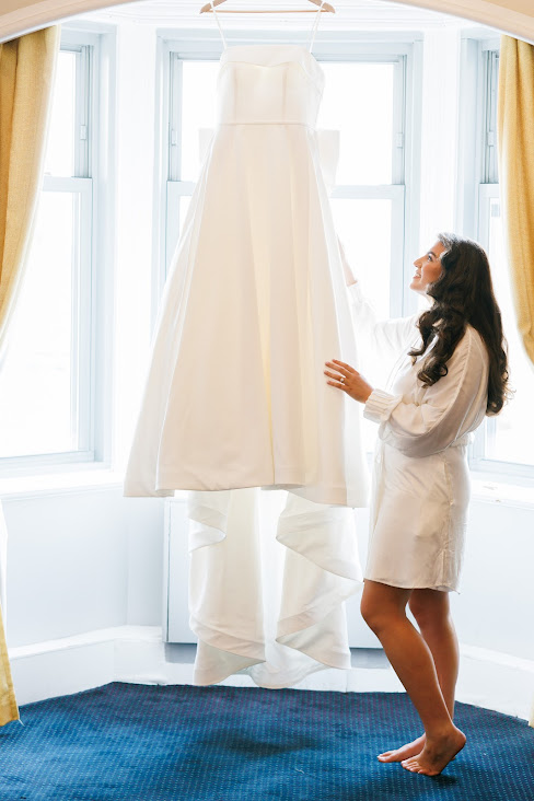 Bride looking at her wedding dress